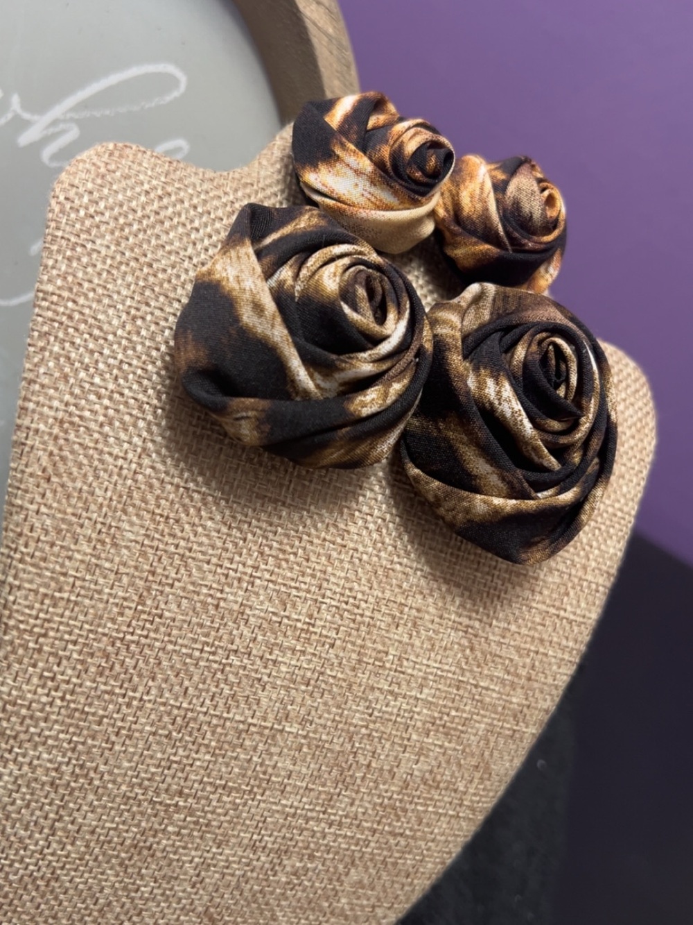Leopard print rose earrings in Black and Gold